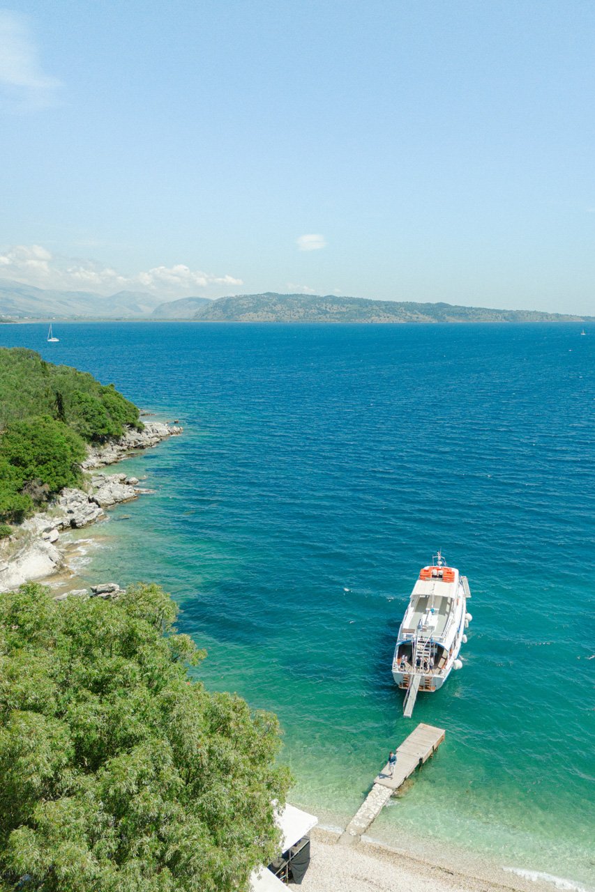 corfu wedding. arrive at your wedding by boat